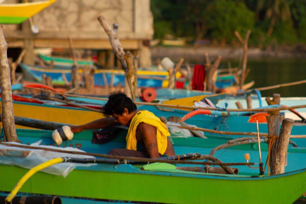 Local fisherman preparing a colorful banca boat in Biliran, Philippines.