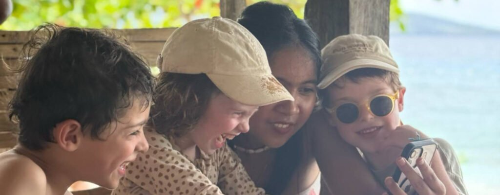 Children sharing a happy moment during a Filipino homestay by the sea